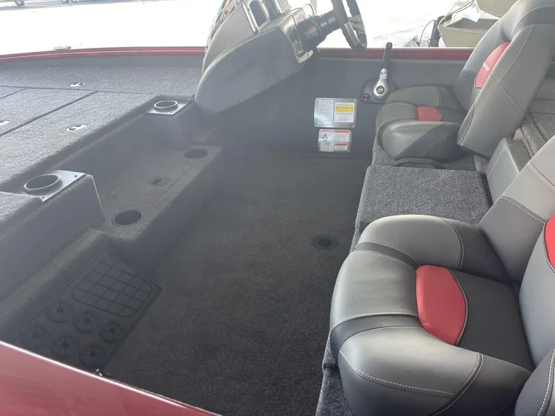 Slide: The Image of 2025 Tracker Pro Team 195 Tournament Edition boat interior with seating and steering console. - 4
