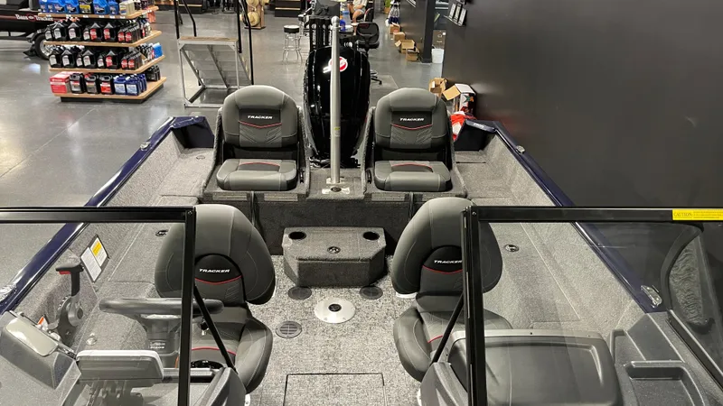 Slide: The Image of 2025 Tracker Pro Guide V-175 Combo boat interior with seating and storage. - 11