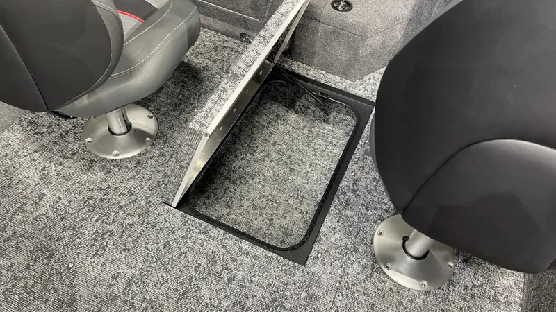 Slide: The Image of 2025 Tracker Pro Guide V-175 Combo boat interior with open storage compartment. - 21