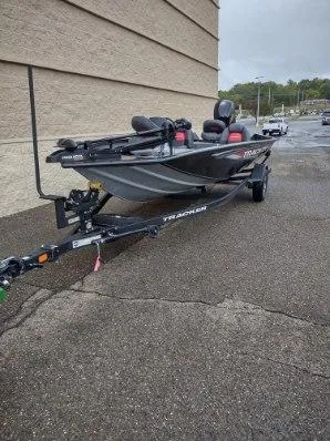 Slide: The Image of 2025 Tracker Pro Team 195 Tournament Edition boat on trailer, parked outdoors. - 3