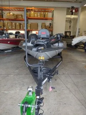 Slide: The Image of 2025 Tracker Pro Team 195 Tournament Edition boat in a garage setting. - 5