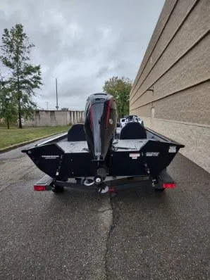 Slide: The Image of 2025 Tracker Pro Team 195 Tournament Edition boat, rear view, parked outdoors. - 6