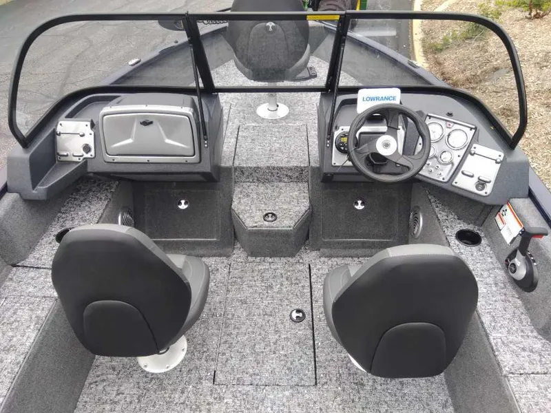Slide: The Image of 2025 Tracker Pro Guide V-175 Combo boat interior with dual seats and control panel. - 3