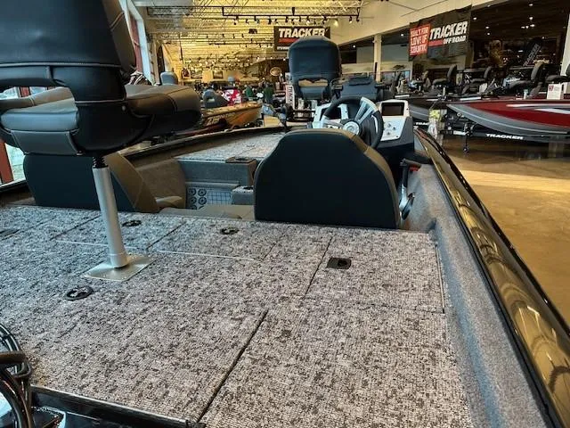 Slide: The Image of 2025 Tracker Pro Team 195 Tournament Edition boat interior in showroom. - 3