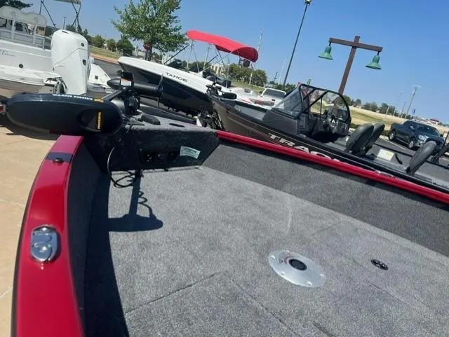 Slide: The Image of 2025 Tracker Pro Guide V-175 Combo boat with red trim and spacious deck. - 3