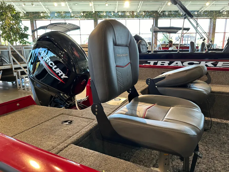 Slide: The Image of 2025 Tracker Pro Guide V-16 WT boat interior with Mercury engine and comfortable seating. - 2