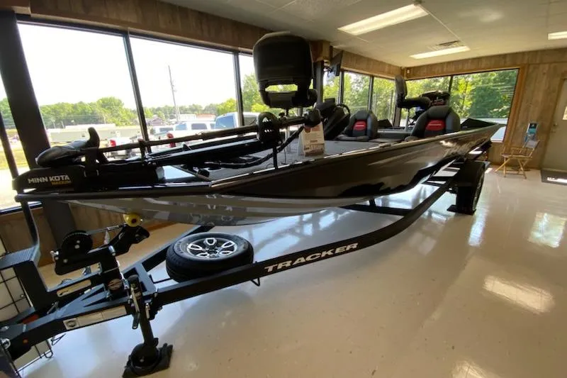 The Image of 2025 Tracker Pro Team 195 Tournament Edition boat displayed indoors on a trailer. - 0