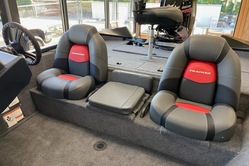 Slide: The Image of 2025 Tracker Pro Team 195 Tournament Edition boat interior with dual seats and steering wheel. - 4