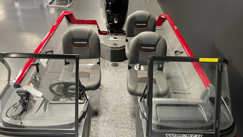 Slide: The Image of 2025 Tracker Pro Guide V-16 WT boat interior with seating and steering console. - 15