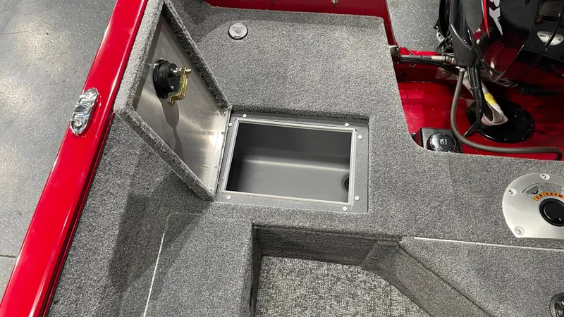 Slide: The Image of 2025 Tracker Pro Guide V-16 WT boat interior with storage compartment. - 17