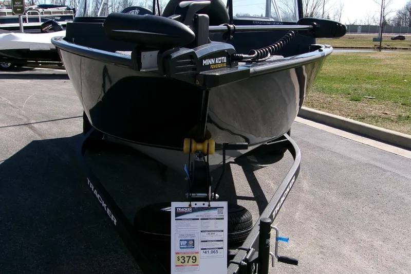 Slide: The Image of 2025 Tracker Pro Guide V-175 Combo boat with Minn Kota motor on display. - 3
