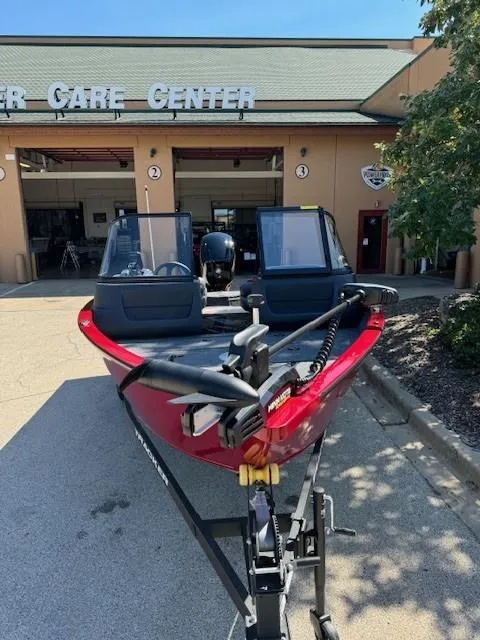 Slide: The Image of 2025 Tracker Pro Guide V-16 WT boat in front of service center. - 4