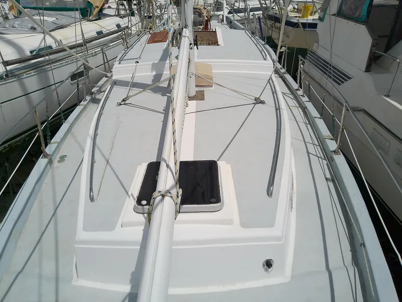 Slide: The Image of 1978 Downeast 38 sailboat deck view with rigging and hatches. - 13