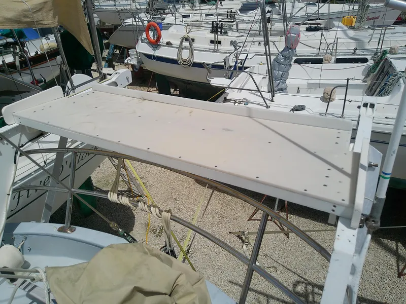 Slide: The Image of 1978 Downeast 38 sailboat deck with marina background. - 17