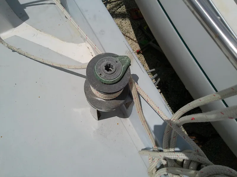Slide: The Image of Close-up of a 1978 Downeast 38 sailboat deck fitting with ropes. - 20