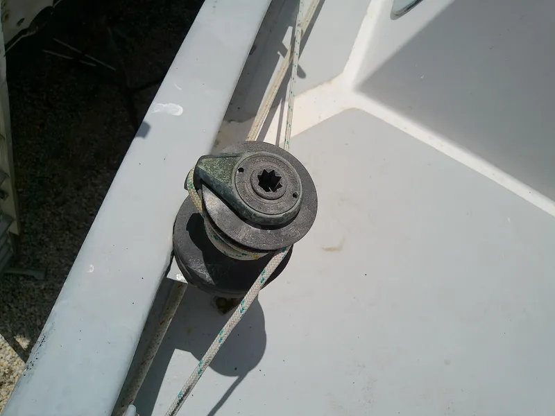 Slide: The Image of Winch on 1978 Downeast 38 sailboat deck, with rope and fittings. - 21
