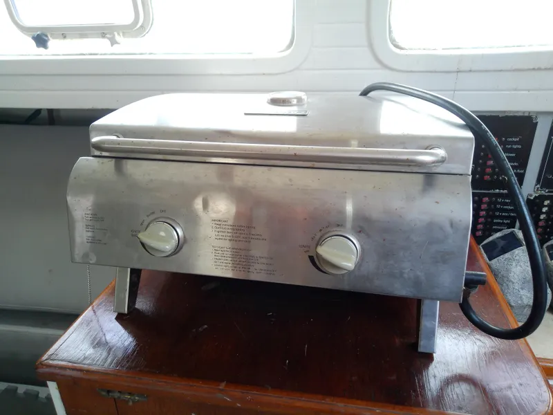 Slide: The Image of Stainless steel grill on a 1978 Downeast 38 boat interior. - 36