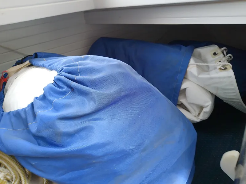 Slide: The Image of Blue sail bags in a 1978 Downeast 38 boat storage area. - 38