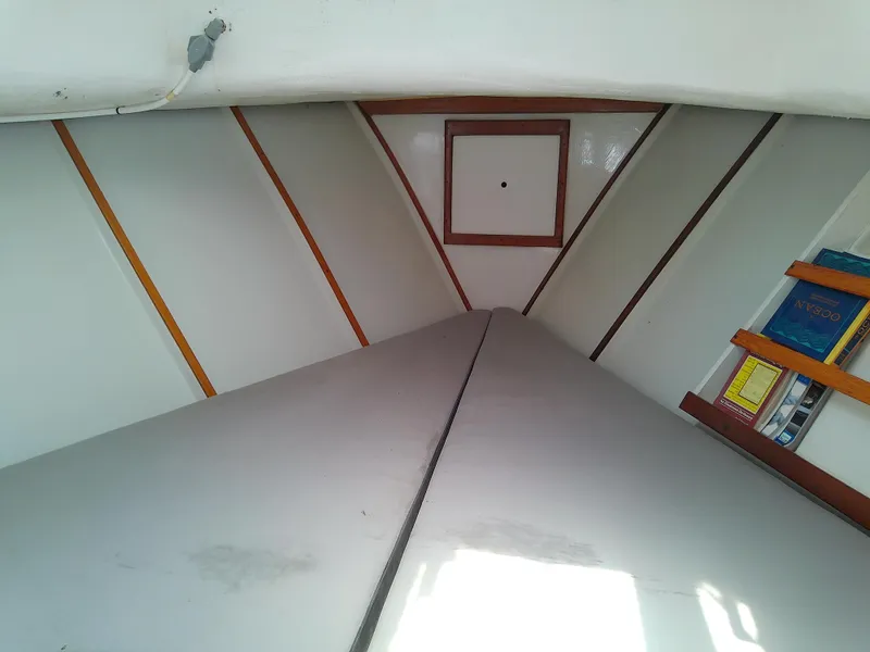 Slide: The Image of Interior cabin of 1978 Downeast 38 sailboat with books on shelf. - 43