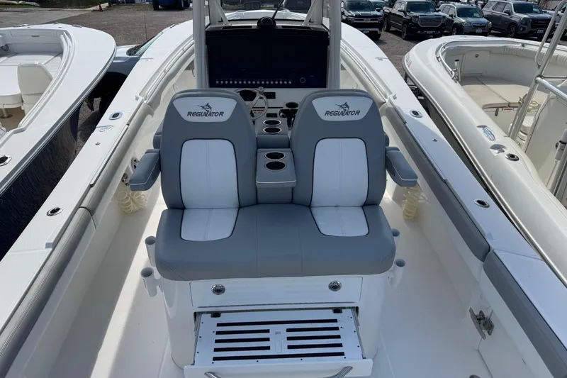 Slide: The Image of 2022 Regulator 31 boat interior, showcasing sleek design and spacious deck layout. - 12