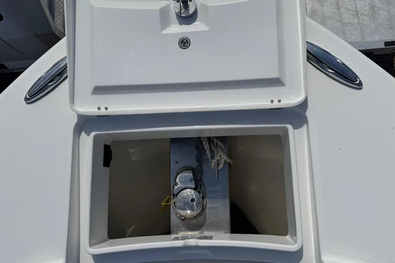 Slide: The Image of Storage compartment with tackle boxes on a 2022 Regulator 31 boat. - 26
