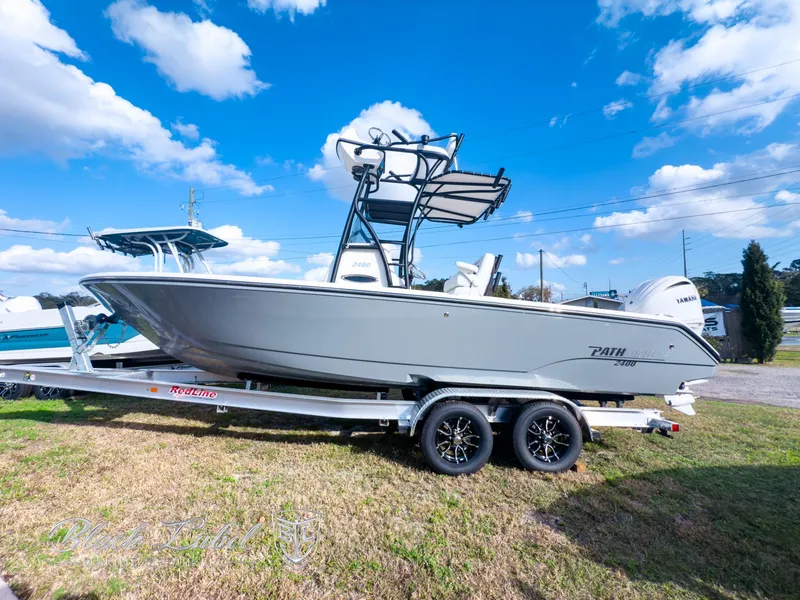 The Image of 2025 Pathfinder Open 2400 boat on trailer under blue sky. - 0