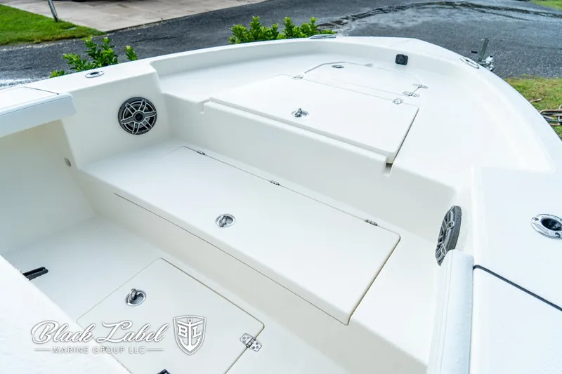 Slide: The Image of 2025 Pathfinder Open 2400 boat interior with storage compartments and speakers. - 2