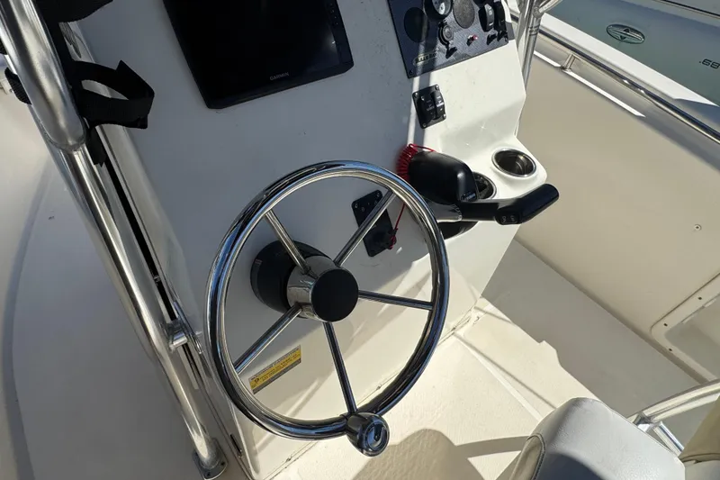 Slide: The Image of 2019 Bulls Bay 230 Center Console steering wheel and control panel. - 10
