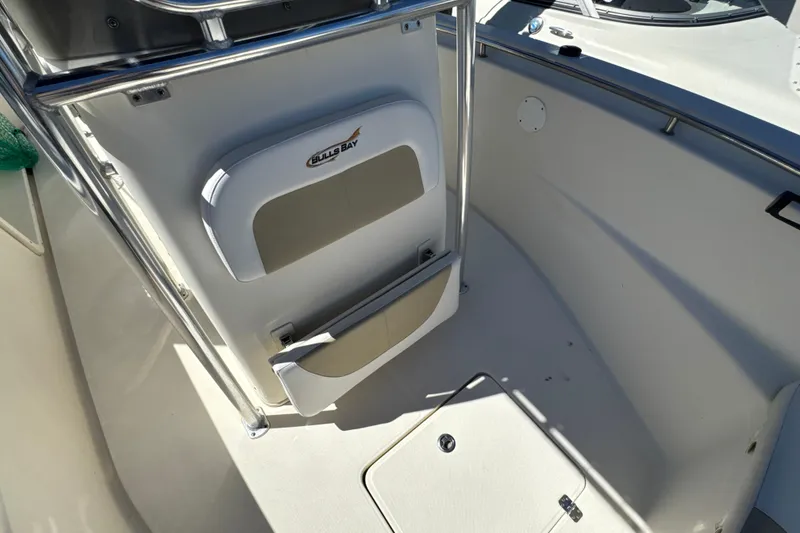 Slide: The Image of 2019 Bulls Bay 230 Center Console boat interior with seating and storage. - 17
