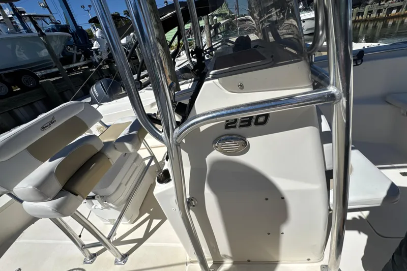 Slide: The Image of 2019 Bulls Bay 230 Center Console boat interior with seating and console details. - 21