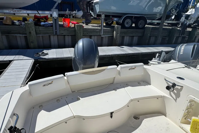 Slide: The Image of 2019 Bulls Bay 230 Center Console boat docked, featuring Yamaha outboard motor. - 5