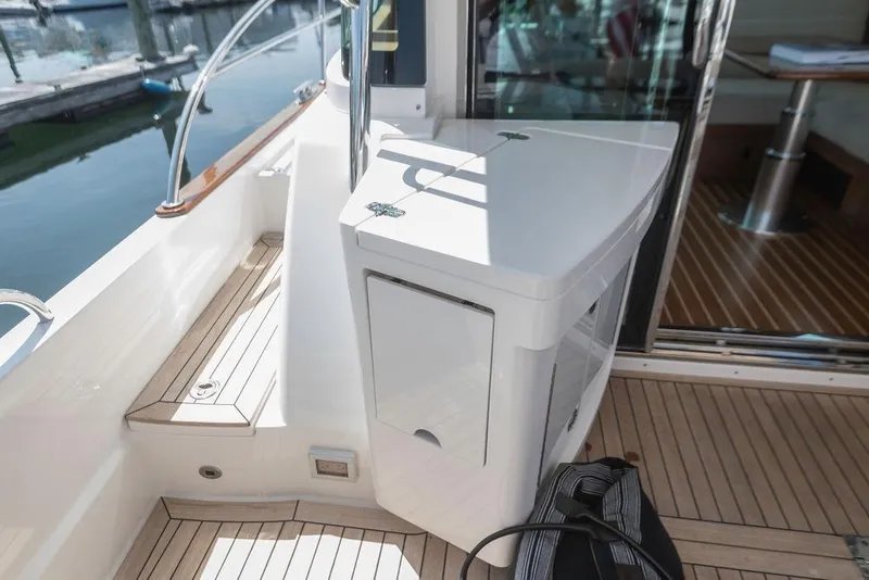 Slide: The Image of 2025 Sabre 43 Salon Express yacht interior with sleek design and wooden flooring. - 17