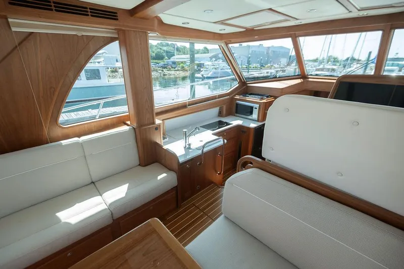 Slide: The Image of Luxurious interior of 2025 Sabre 43 Salon Express yacht with elegant wood finish. - 22