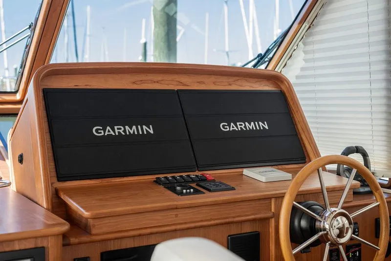 Slide: The Image of 2025 Sabre 43 Salon Express helm with Garmin navigation displays. - 31