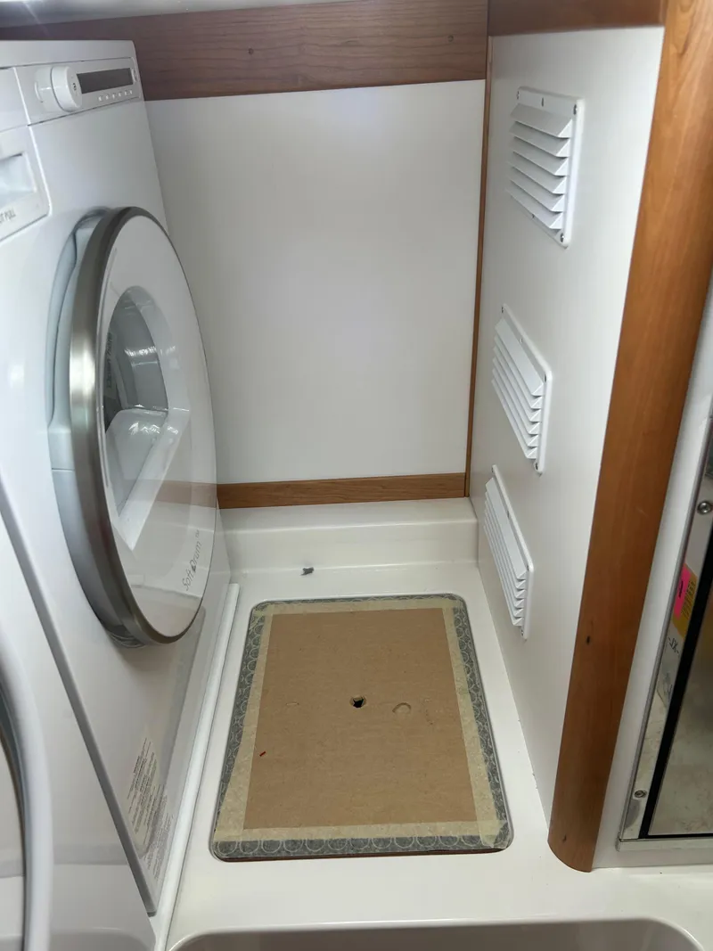 Slide: The Image of Laundry area in 2025 Sabre 43 Salon Express yacht. - 39