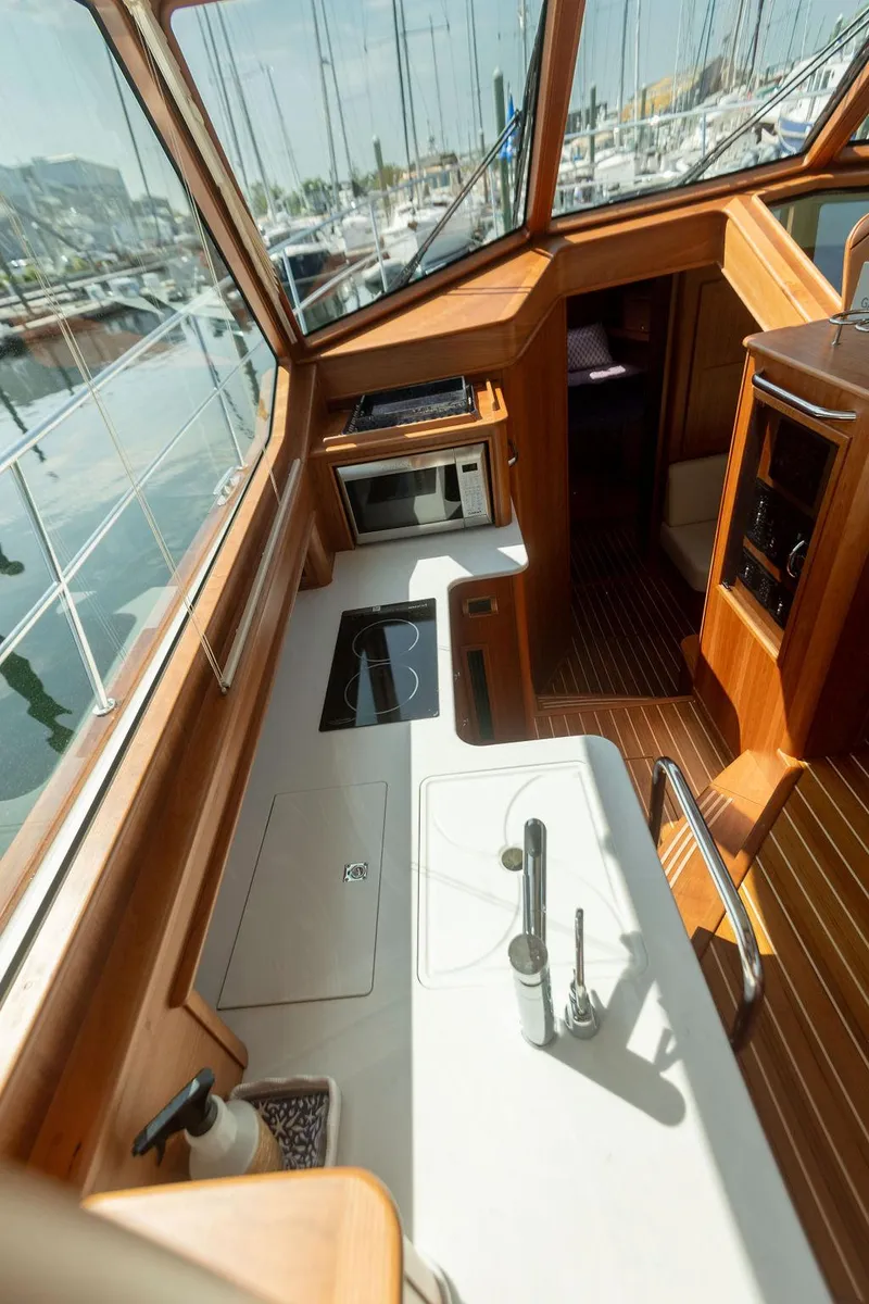 Slide: The Image of Interior of 2025 Sabre 43 Salon Express yacht with modern kitchen amenities. - 43