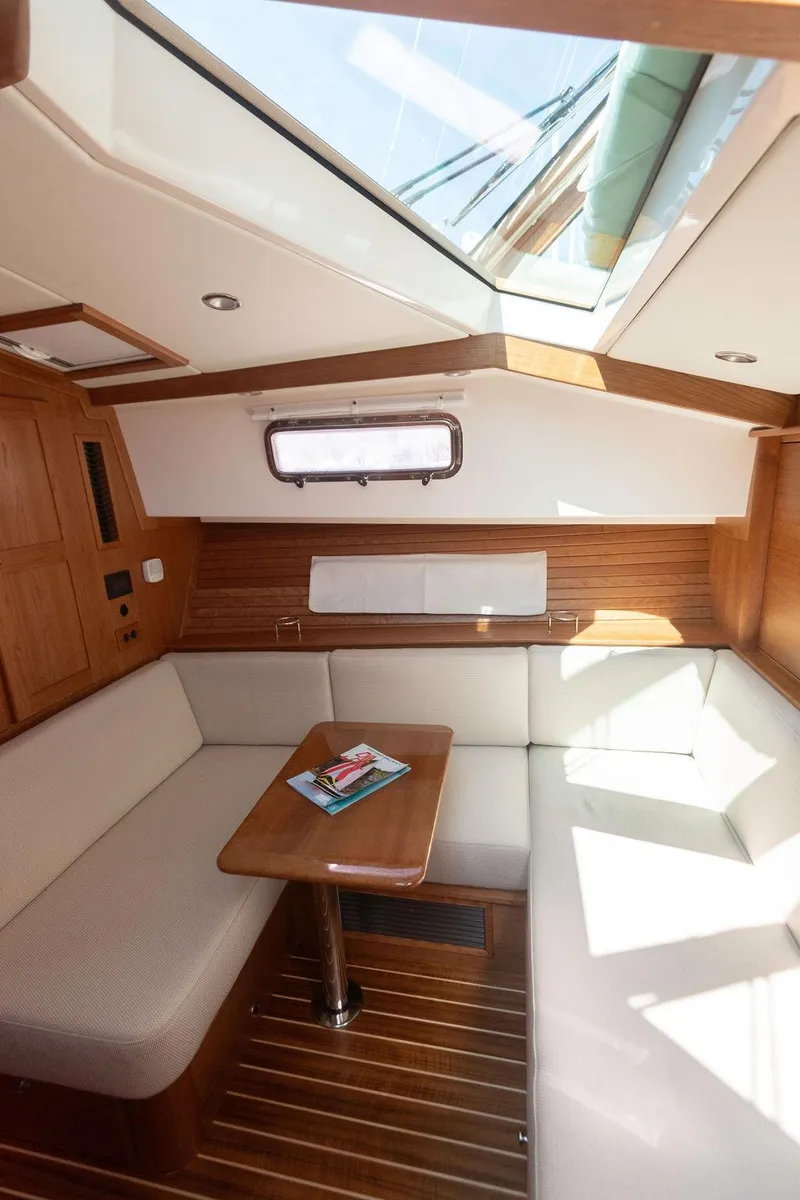 Slide: The Image of Interior of 2025 Sabre 43 Salon Express yacht with skylight and cozy seating area. - 46