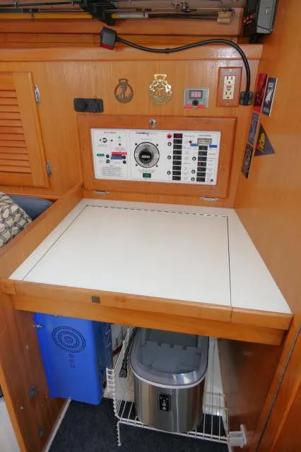 Slide: The Image of Control panel and storage area in 1995 Catalina 36 Mk II sailboat interior. - 15