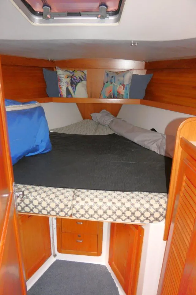 Slide: The Image of Cozy cabin interior of 1995 Catalina 36 Mk II sailboat with bedding and storage. - 16
