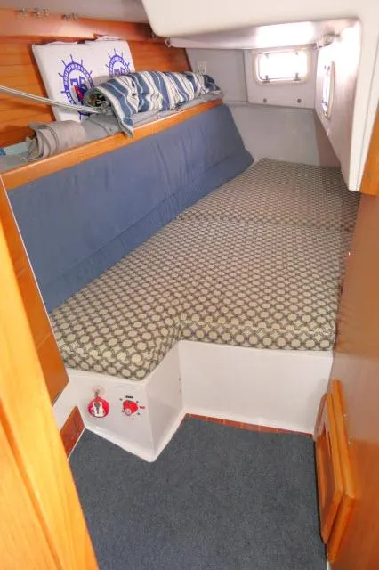 Slide: The Image of Cozy cabin interior of 1995 Catalina 36 Mk II sailboat with patterned bedding. - 20