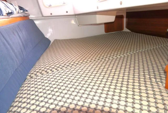 Slide: The Image of Cozy cabin interior of 1995 Catalina 36 Mk II sailboat with patterned bedding. - 22