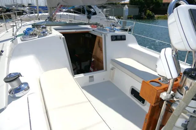 Slide: The Image of 1995 Catalina 36 Mk II sailboat cockpit with open cabin entrance and seating. - 24