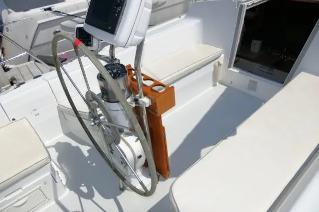 Slide: The Image of Cockpit of 1995 Catalina 36 Mk II sailboat with steering wheel and navigation equipment. - 27