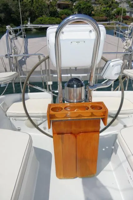 Slide: The Image of Cockpit of 1995 Catalina 36 Mk II sailboat with steering wheel and wooden console. - 28