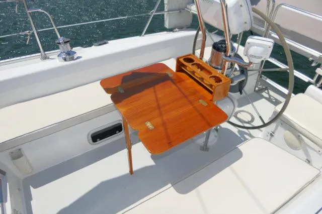 Slide: The Image of Cockpit of 1995 Catalina 36 Mk II sailboat with wooden table and steering wheel. - 30