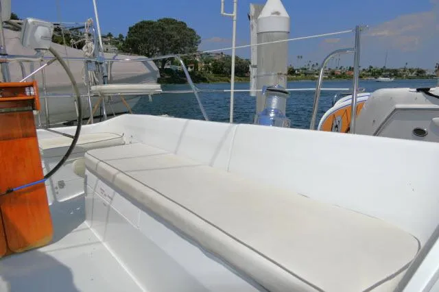 Slide: The Image of 1995 Catalina 36 Mk II sailboat cockpit with cushioned seating and scenic water view. - 31