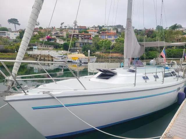 Slide: The Image of 1995 Catalina 36 Mk II sailboat docked in a scenic marina. - 35