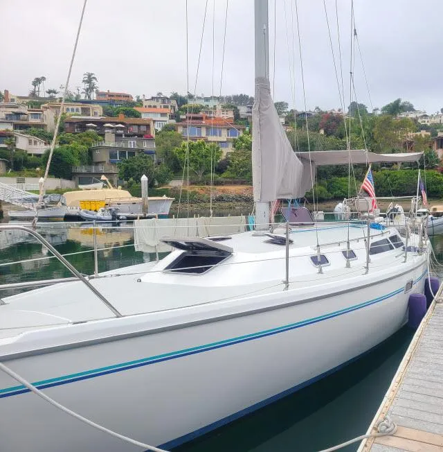 Slide: The Image of Catalina 36 Mk II 1995 sailboat docked in a marina with scenic background. - 36