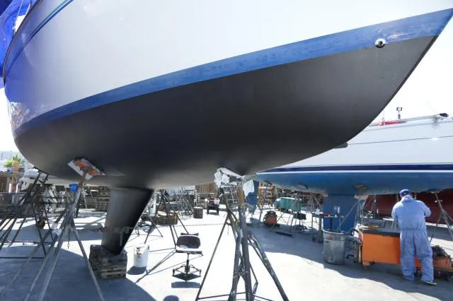 Slide: The Image of Catalina 36 Mk II sailboat from 1995 undergoing maintenance in a boatyard. - 44