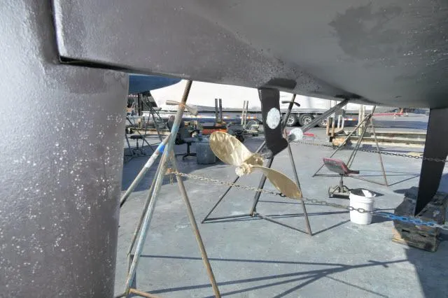 Slide: The Image of Catalina 36 Mk II 1995 sailboat under maintenance, showing propeller and hull. - 48
